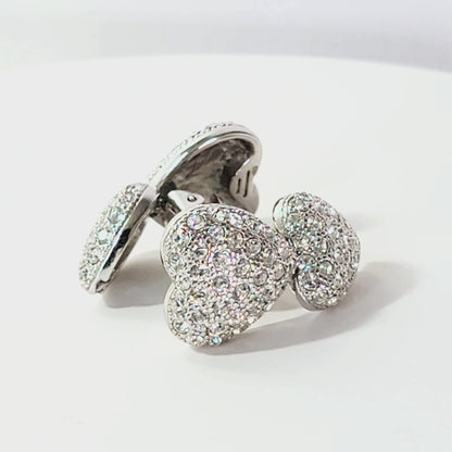 Crystal heart earrings on turntable.