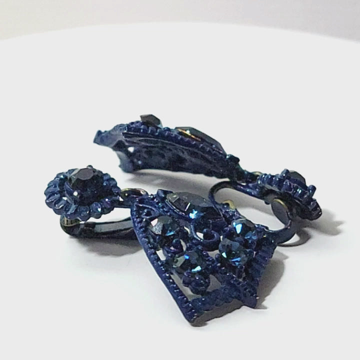 Video of blue rhinestone and enamel earrings.