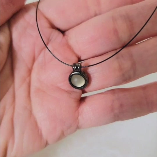 Video of a vintage 90s minimalist gunmetal and glass pendant choker, by Express.