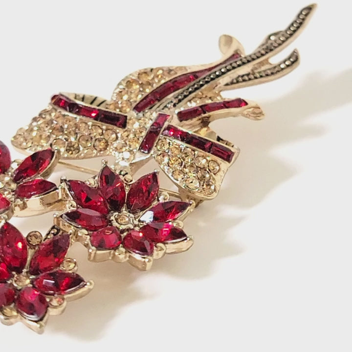 Video of an Avon rhinestone poinsettia Christmas brooch.