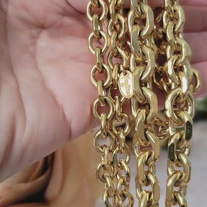 Vintage midcentury style gold chain necklace in hand.