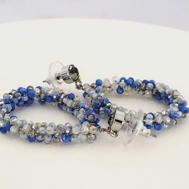 Sparkling blue beaded dangle earrings.