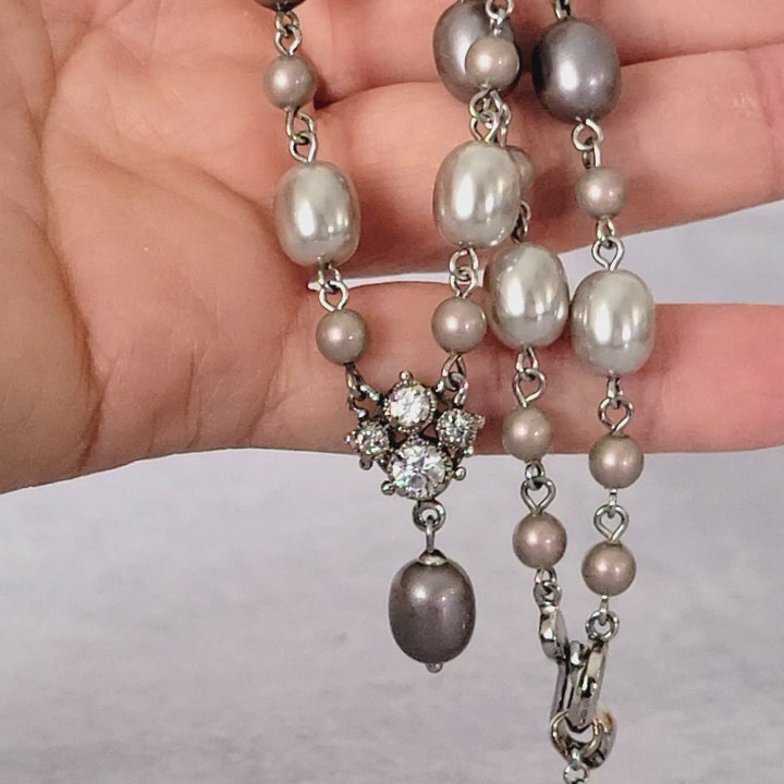 Monet faux pearl choker in hand.