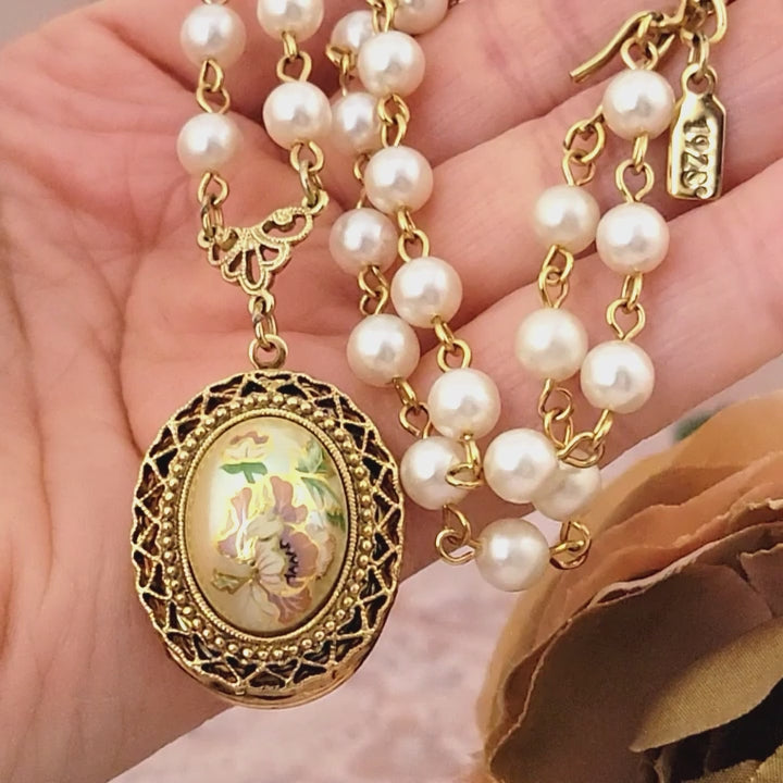 Vintage flower locket choker necklace in hand.