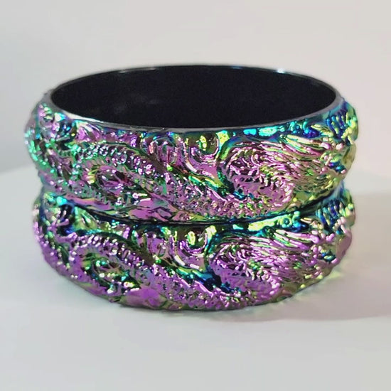Video of iridescent plastic bangle bracelets.