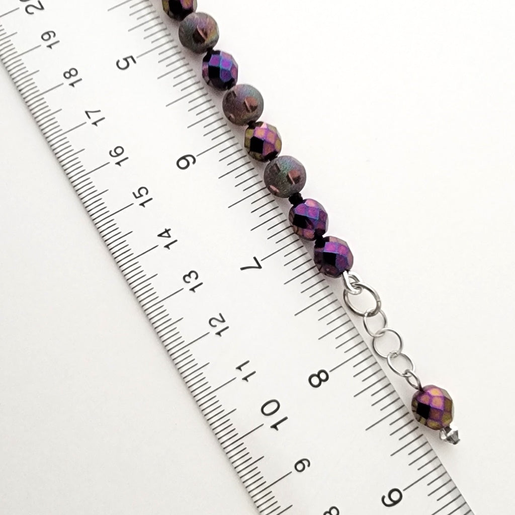 Beaded bracelet with ruler.