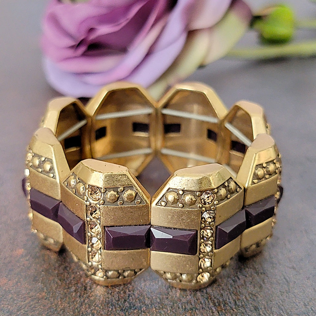 Purple and gold tone rhinestone bracelet.