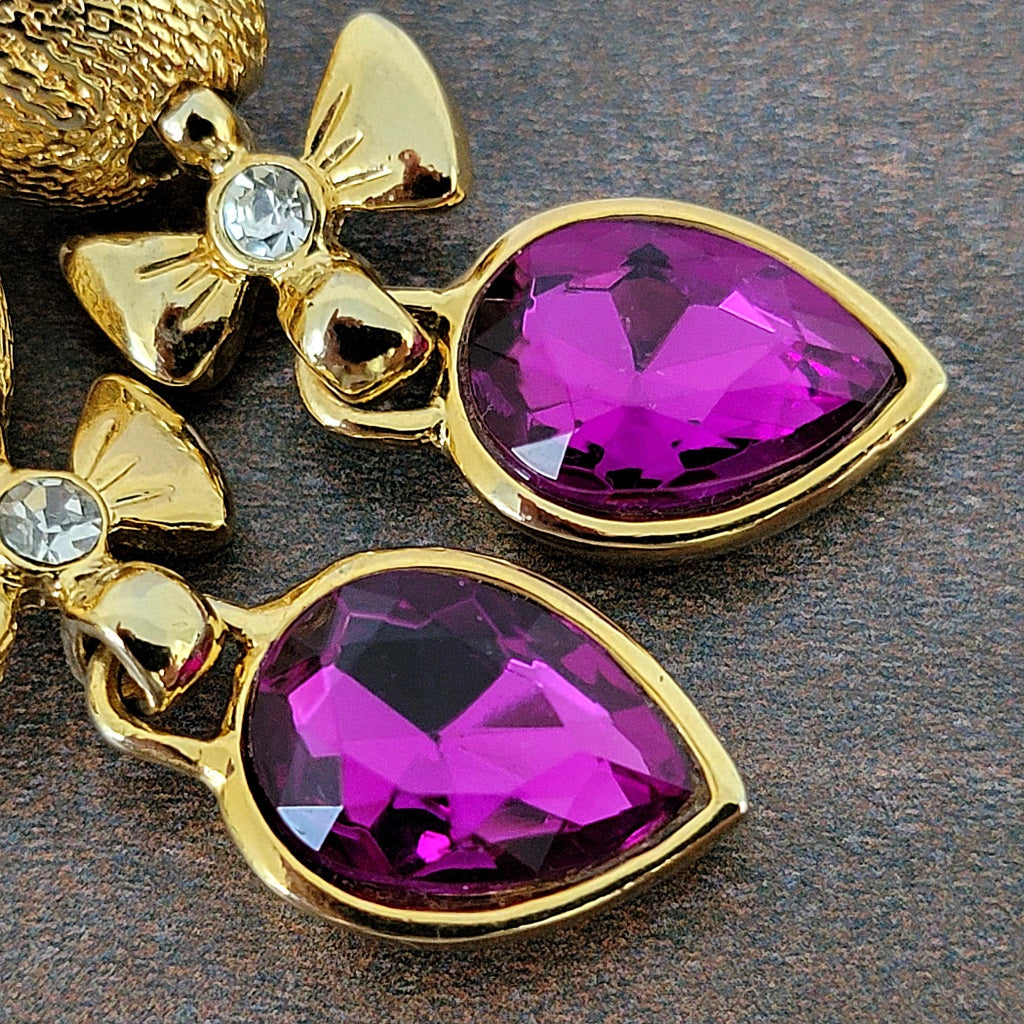 Purple glass pear shaped rhinestones.