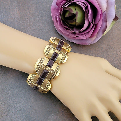 Gold tone rhinestone stretch bracelet on wrist.