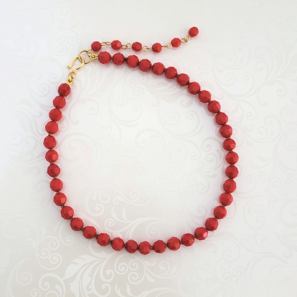 Red hand knotted glass beaded choker, with extender chain.