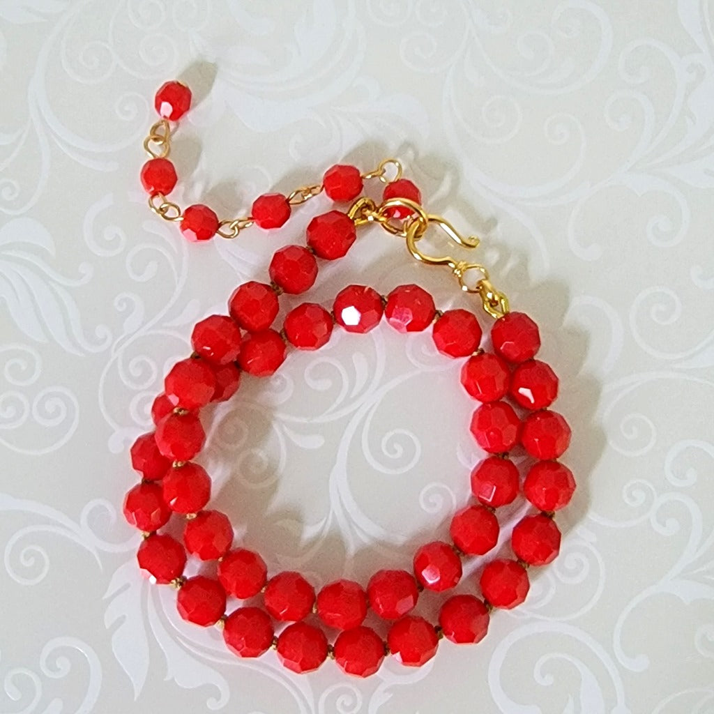 Red hand knotted glass beaded choker, with gold plated hook clasp and extender.