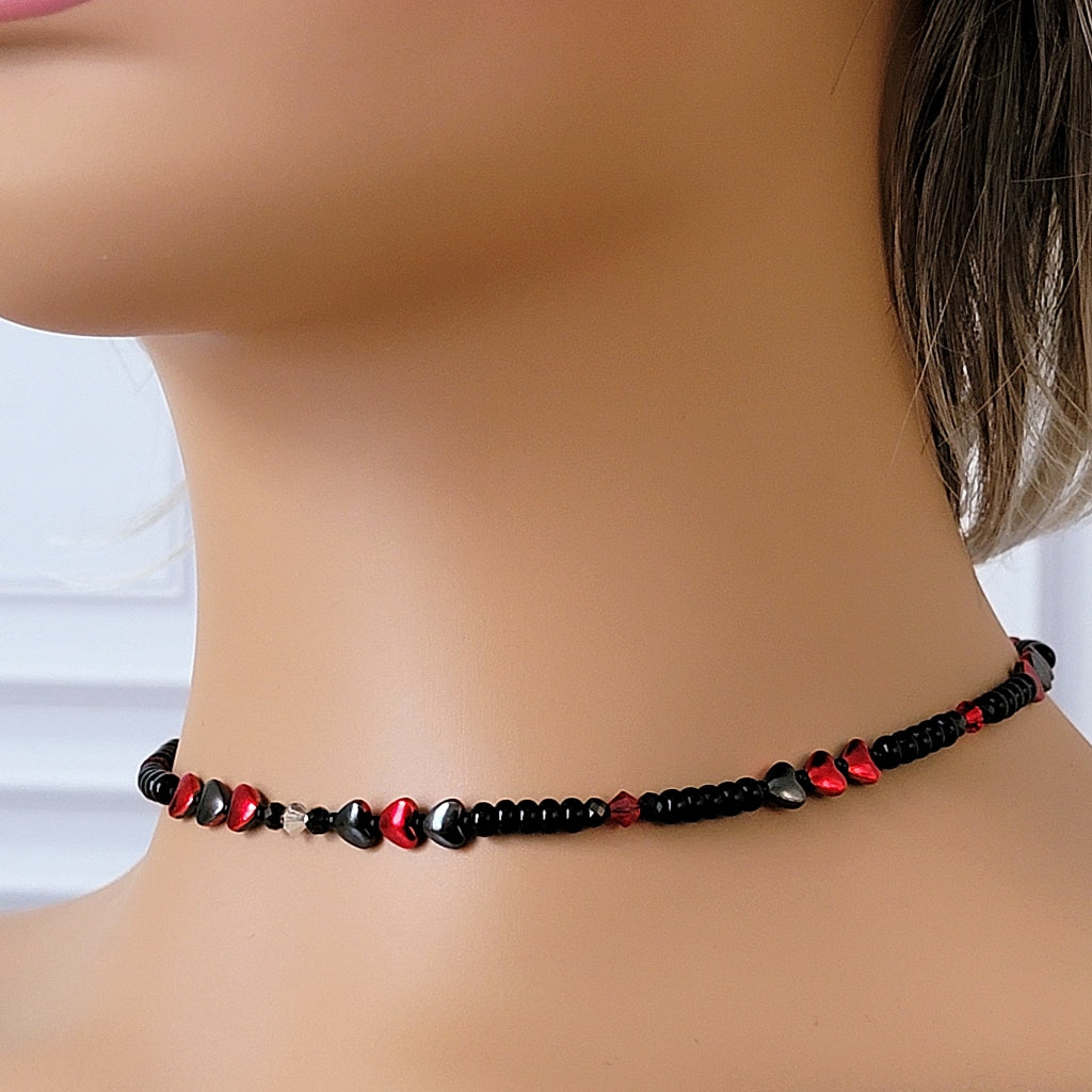 Black choker necklace on a mannequin.