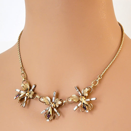 Rhinestone orchid flower choker on a mannequin.