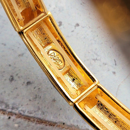 Joan Rivers signature mark on jewelry.