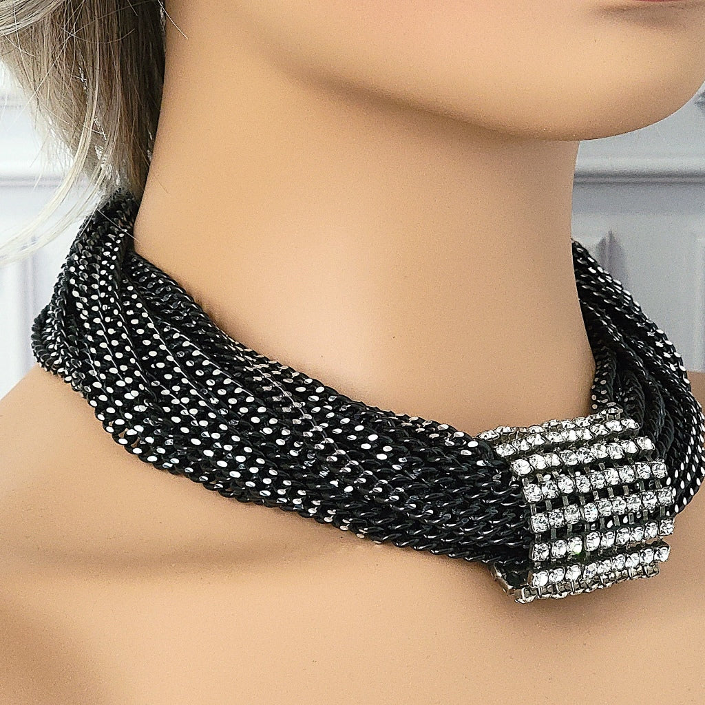 Black multi strand necklace on a mannequin.