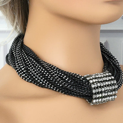 Black multi strand necklace on a mannequin.