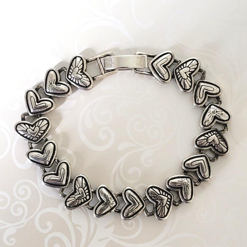 Silver plated hearts bracelet, with black antiqued details, by Brighton.