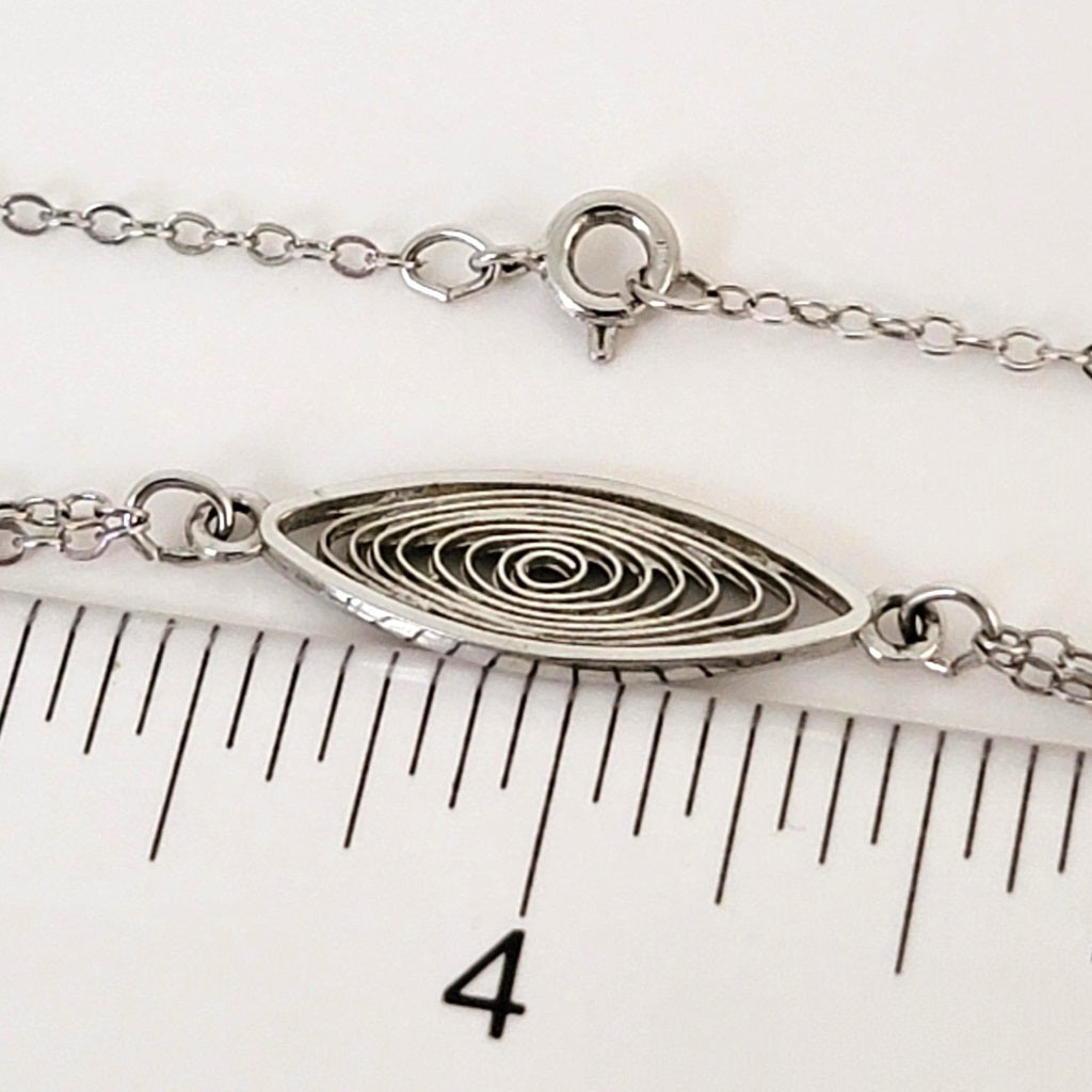 Spiral necklace link with ruler.