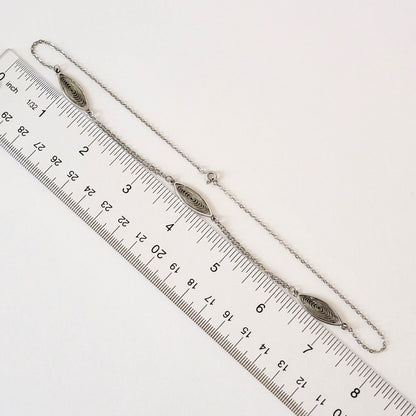 Minimalist choker with ruler.