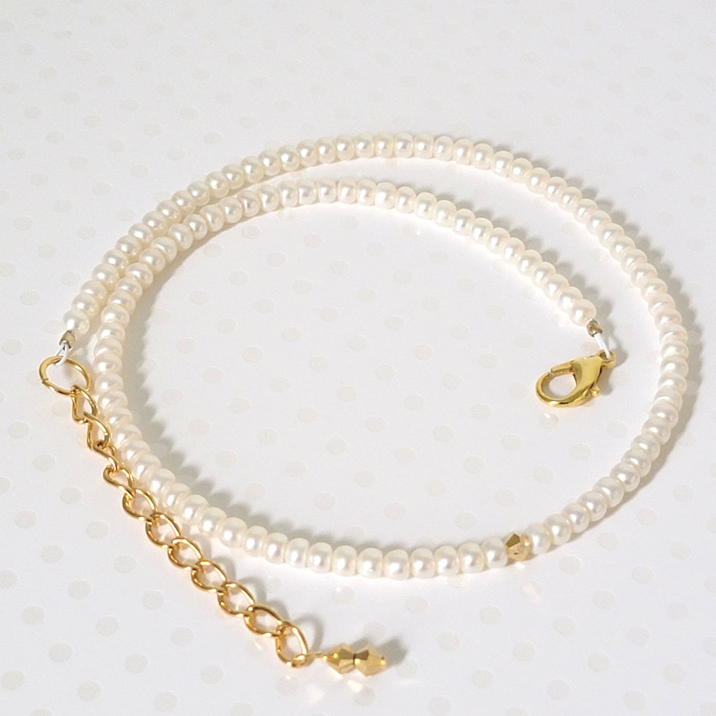 Minimalist skinny pearl and gold crystal choker, with extender chain.