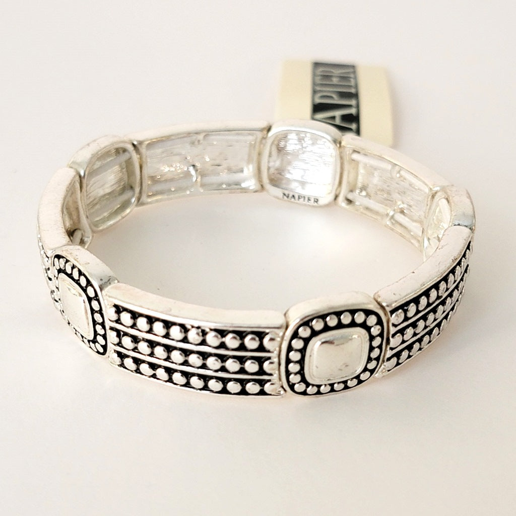 Silver tone stretch bracelet.