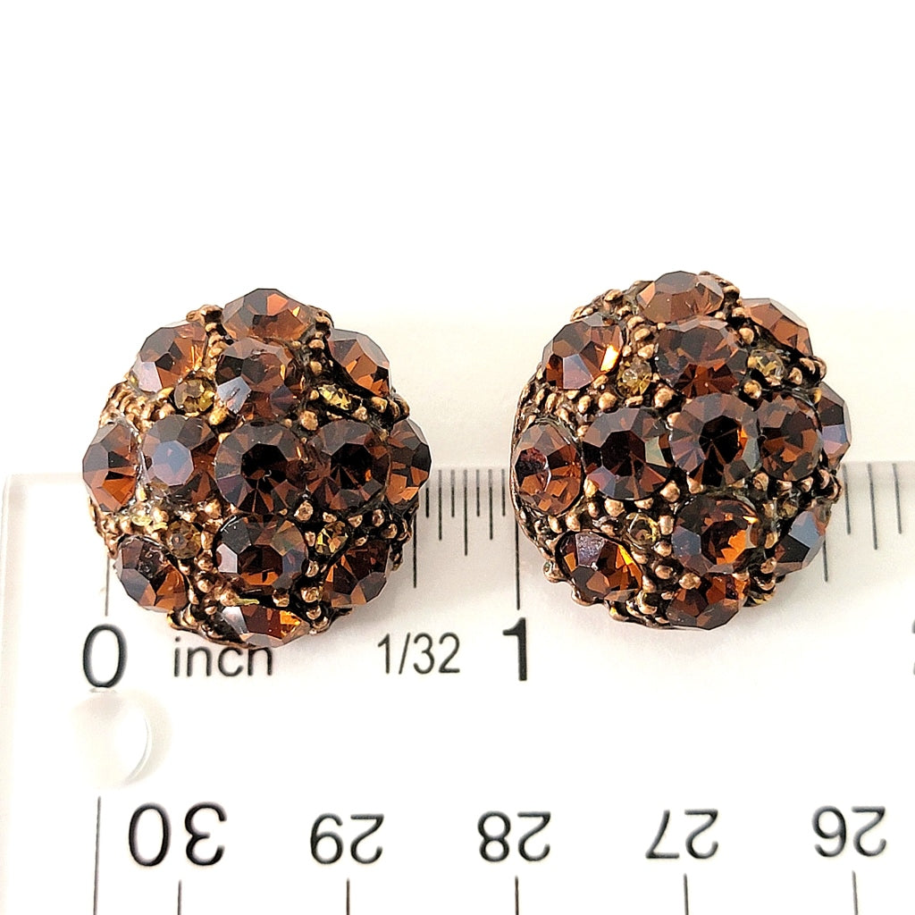 Orange crystal earrings with ruler.
