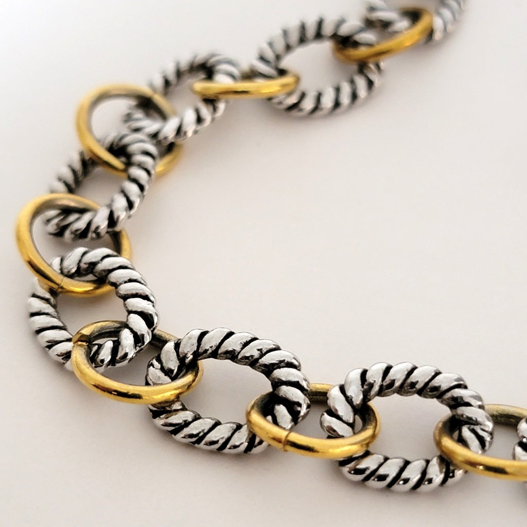 Silver and gold tone chain.