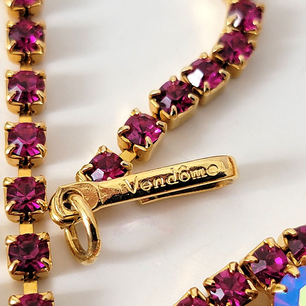 Vendome signature mark on a necklace clasp.