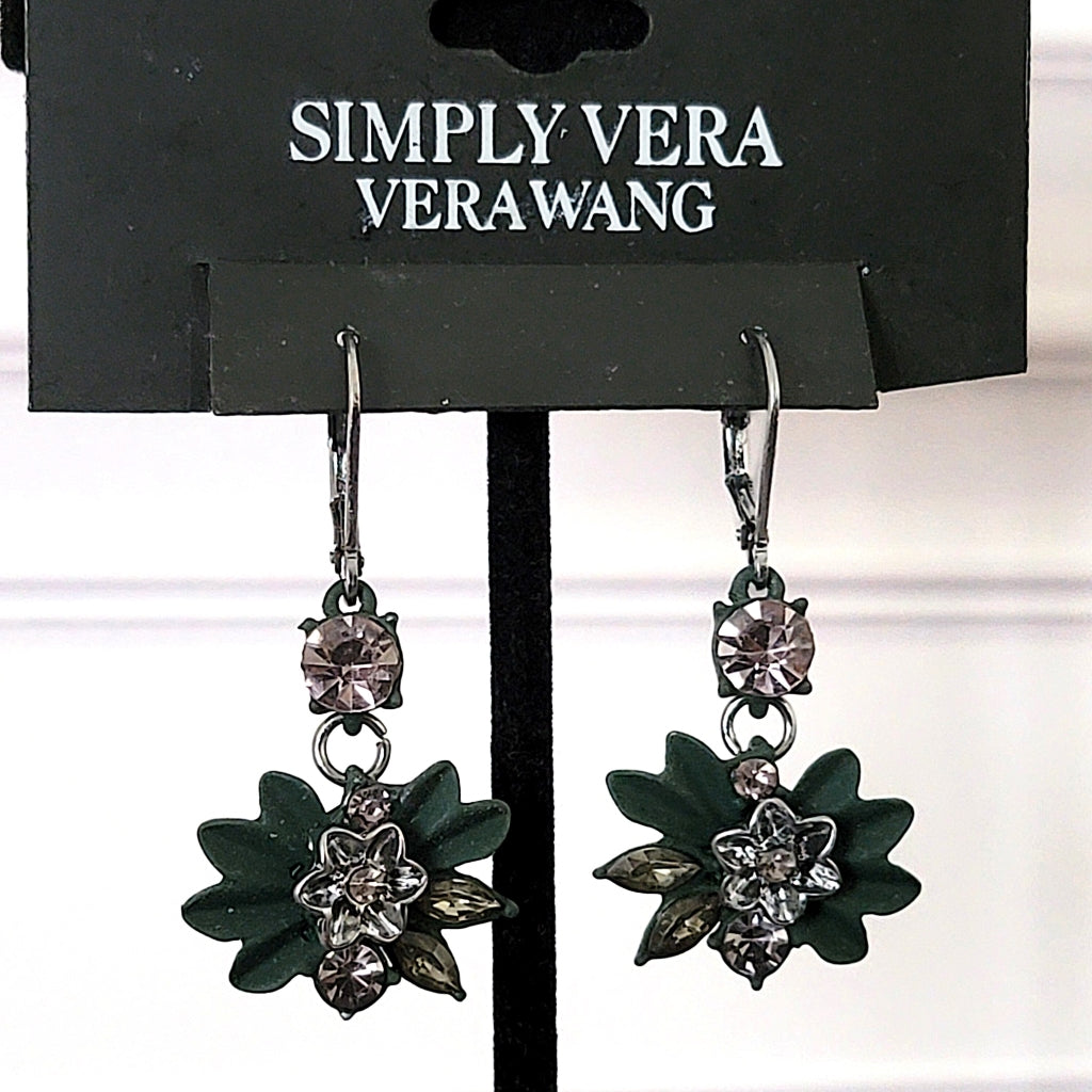 Simply Vera green enamel flower earrings on display stand.