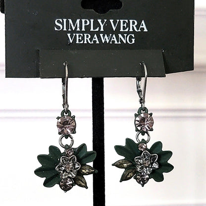 Simply Vera green enamel flower earrings on display stand.