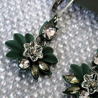 Green enamel flower earring.