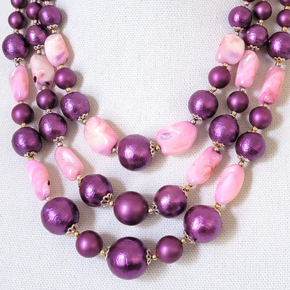 Purple faux pearl and pink shell beads.