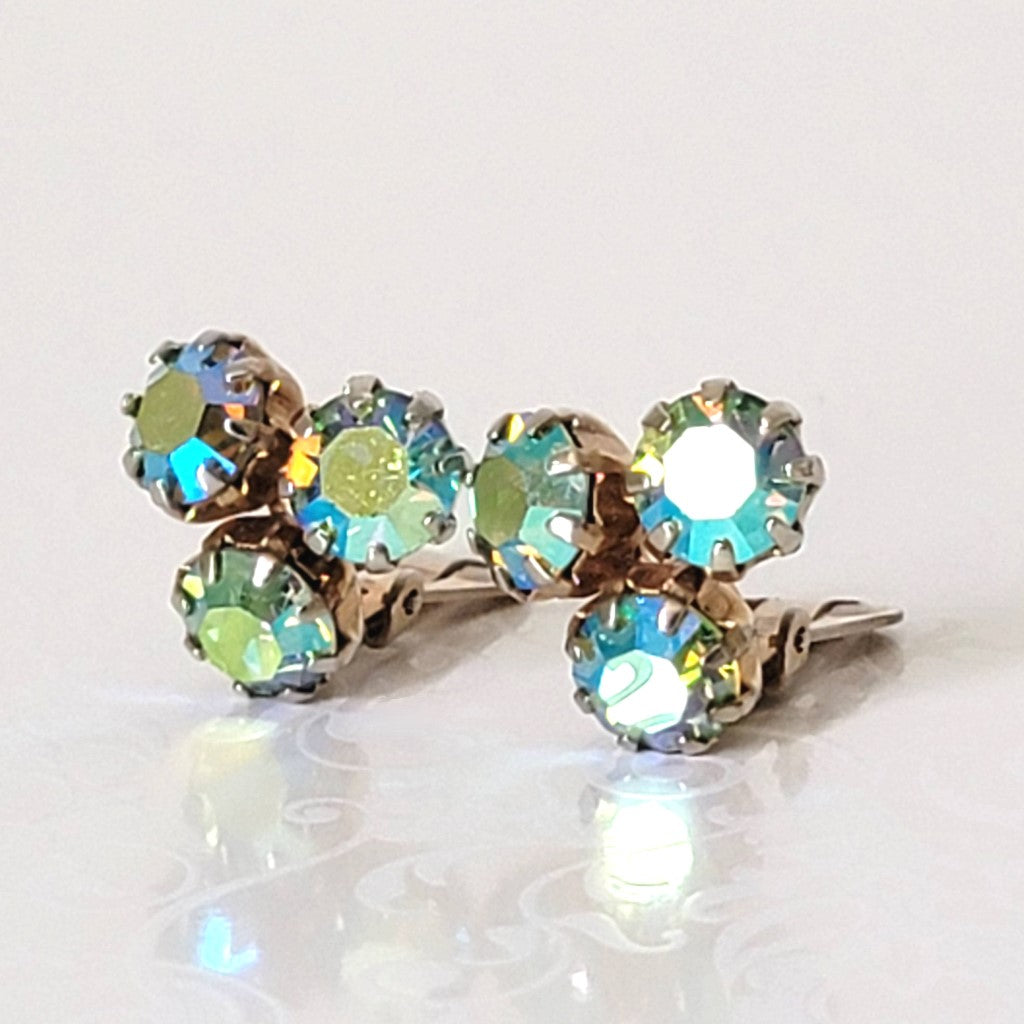 Vintage Weiss triple rhinestone clip-on earrings, with aurora borealis coatings.
