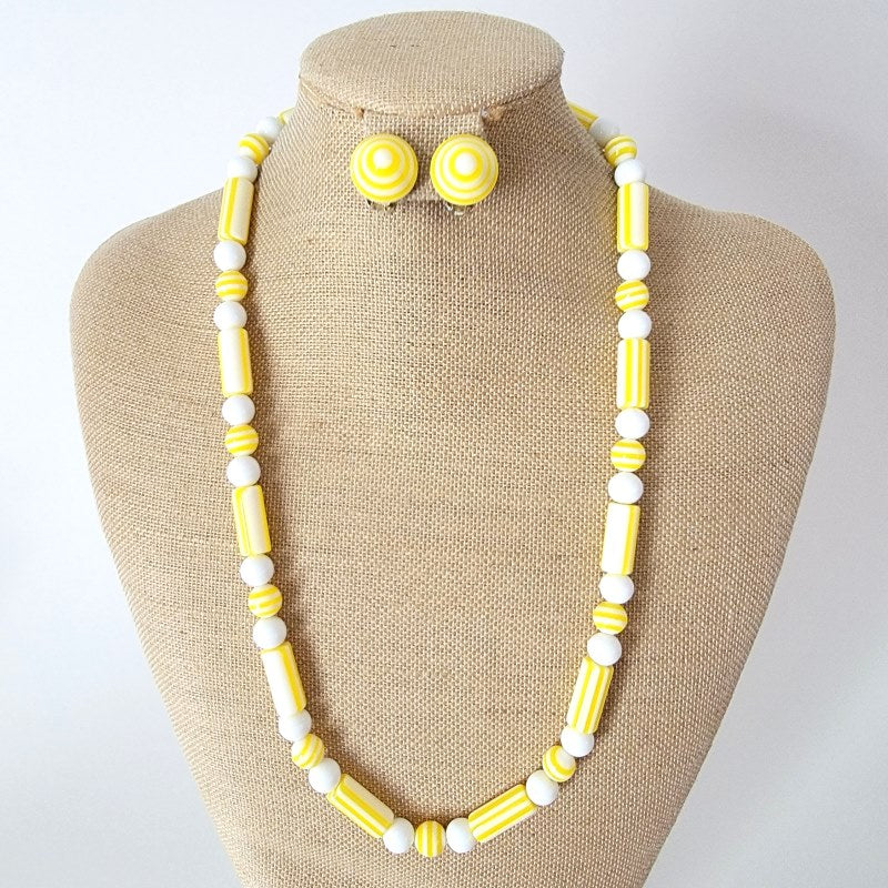 Yellow plastic necklace and earrings.