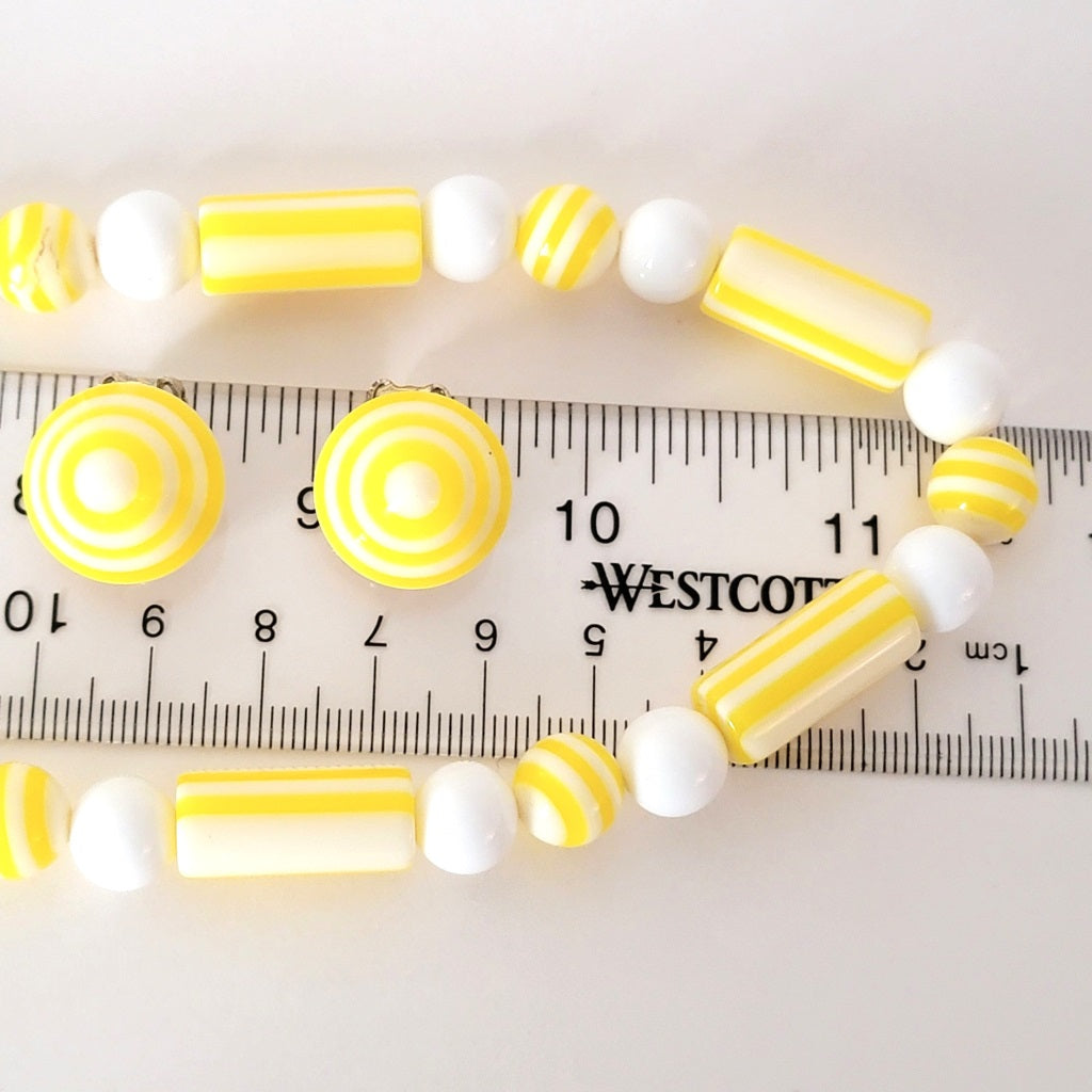 Yellow beads with ruler.
