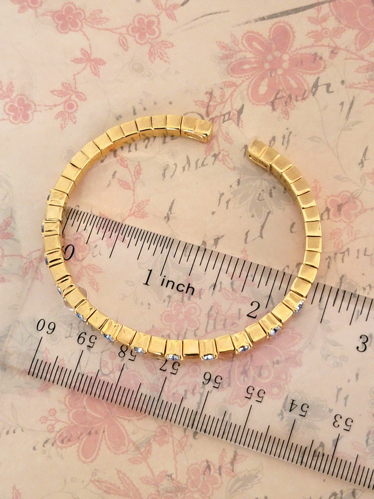 Joan Rivers icy blue rhinestone bracelet, skinny gold tone, flexible