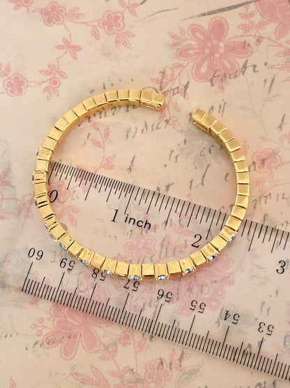 Joan Rivers icy blue rhinestone bracelet, skinny gold tone, flexible