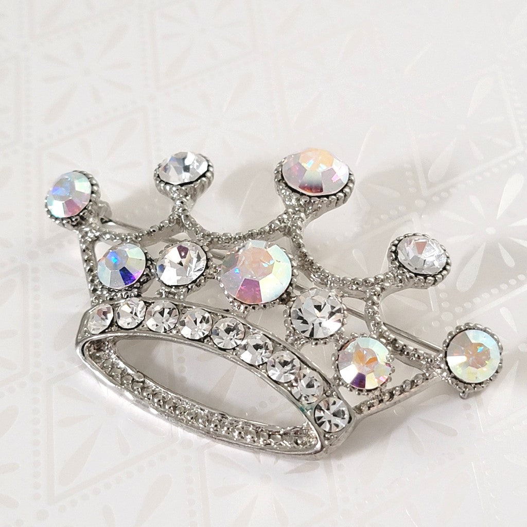 Rhinestone crown brooch, silver tone, with aurora borealis accents.
