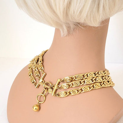 Back view of gold tone Anne Klein snail chain choker, shown on mannequin.
