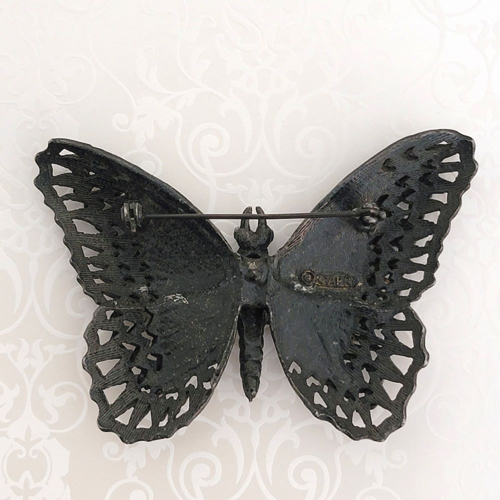 Back view of vintage black enamel butterfly brooch by Capri.