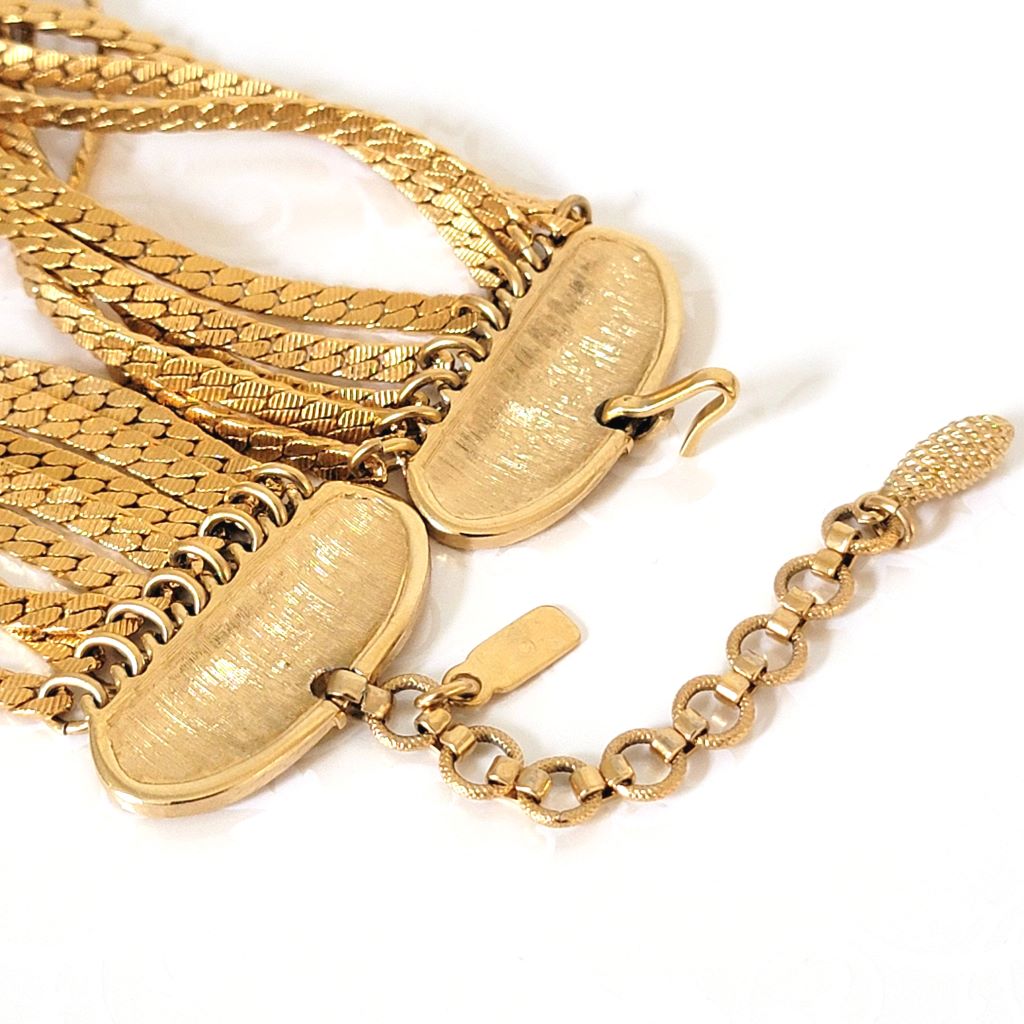 Back view of a vintage Monet necklace clasp.