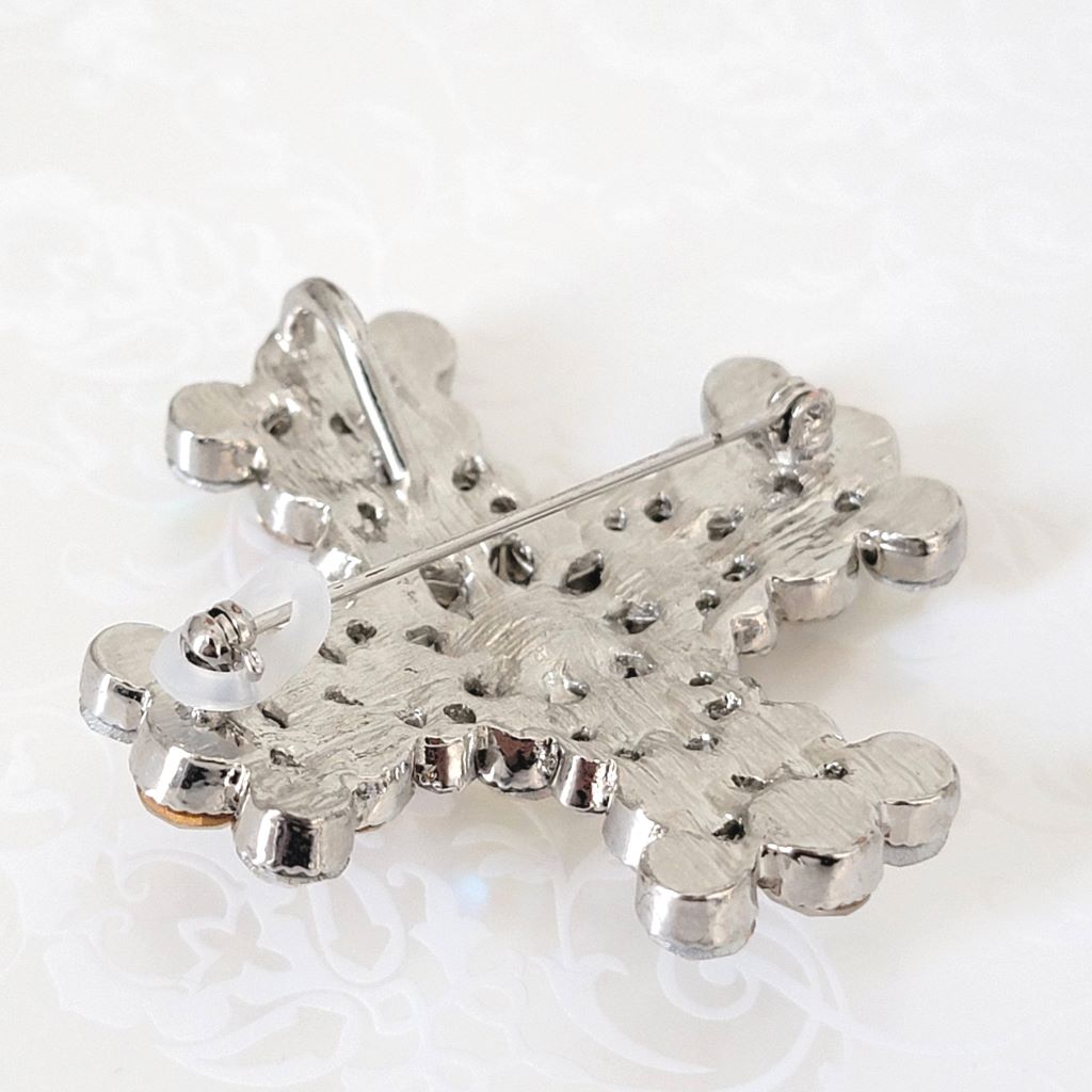 Back view of rhinestone cross pendant brooch, with lock on clasp.