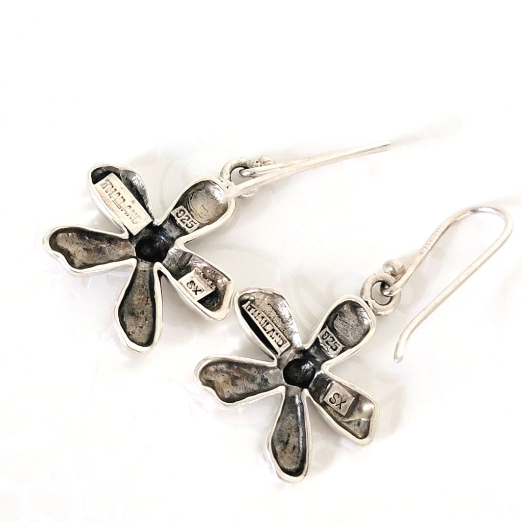 Back view of sterling silver flower earrings, showing marks.