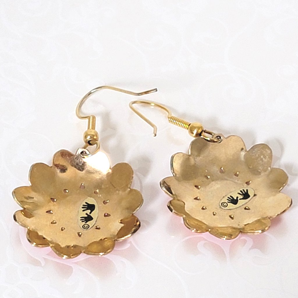 Back view of Two Hands brand enamel flower earrings, showing logo marks.