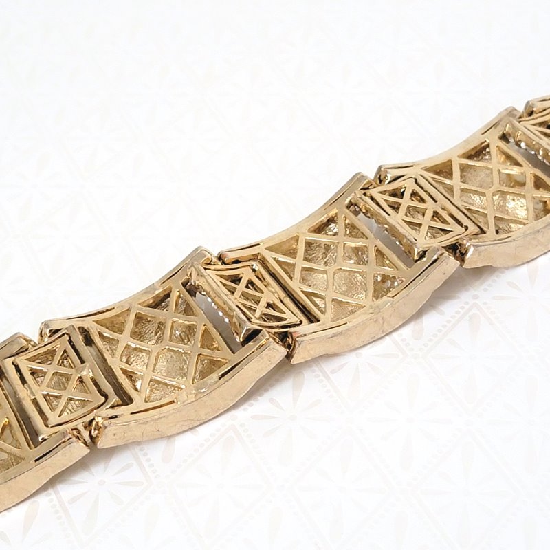 Closeup back view of open links on a pave rhinestone bracelet.