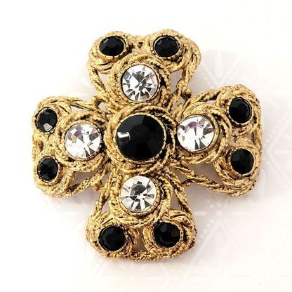 Big chunky, textured gold tone Maltese cross brooch, with black and clear rhinestones.