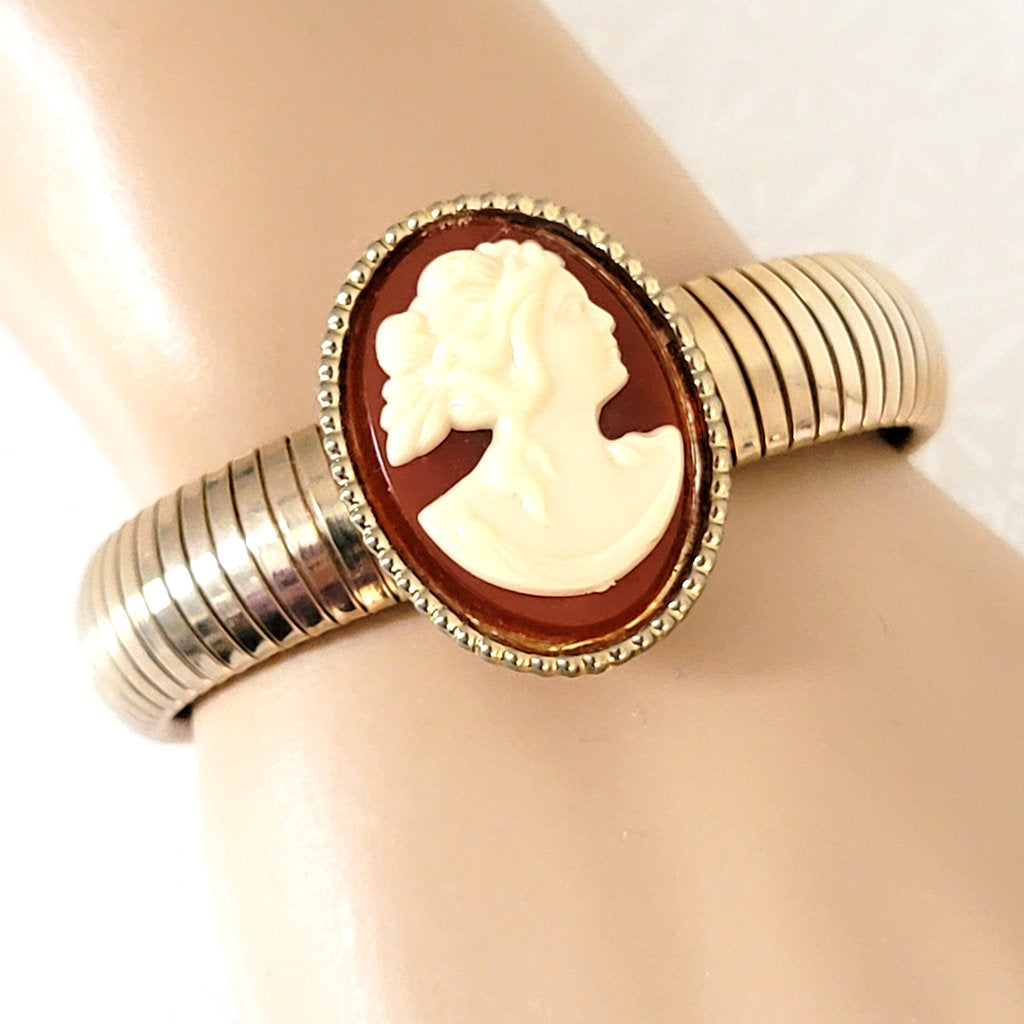 Vintage cameo bracelet, with gold tone omega stretch chain, on wrist.