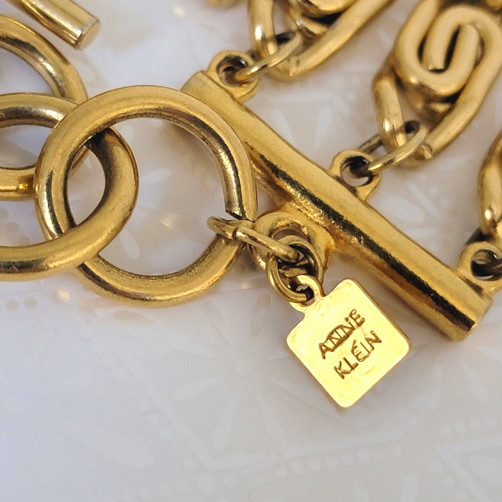 Closeup view of Anne Klein mark on a necklace hang tag.