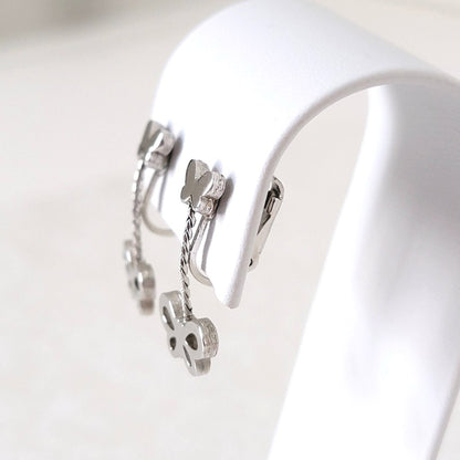 Side view of Crown Trifari butterfly dangle clip earrings.