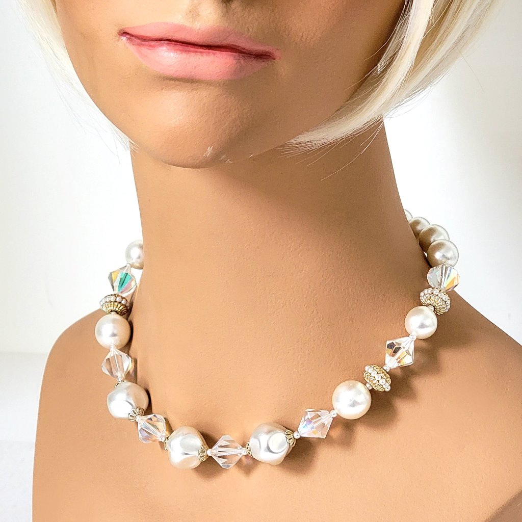 Vintage chunky faux pearl choker, with aurora borealis accents, shown on a mannequin.